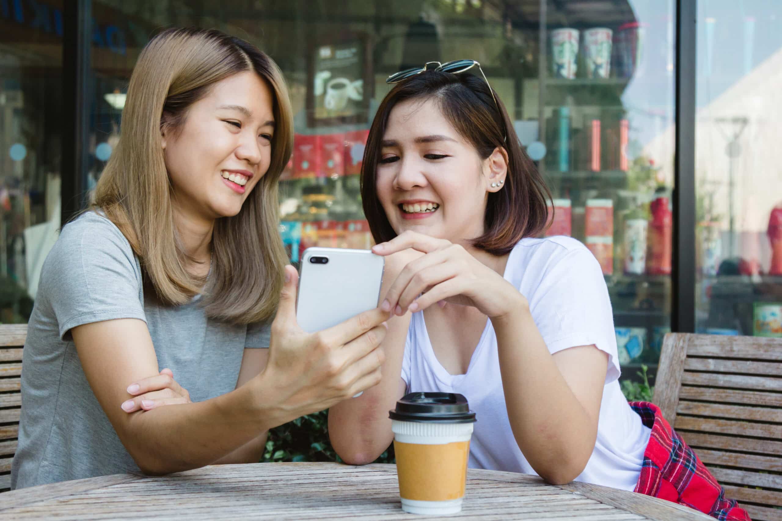Hong Sieng Kong: Bangkok's Riverside Heritage Cafe 5 cheerful asian young women sitting cafe drinking coffee with friends talking together attrac scaled