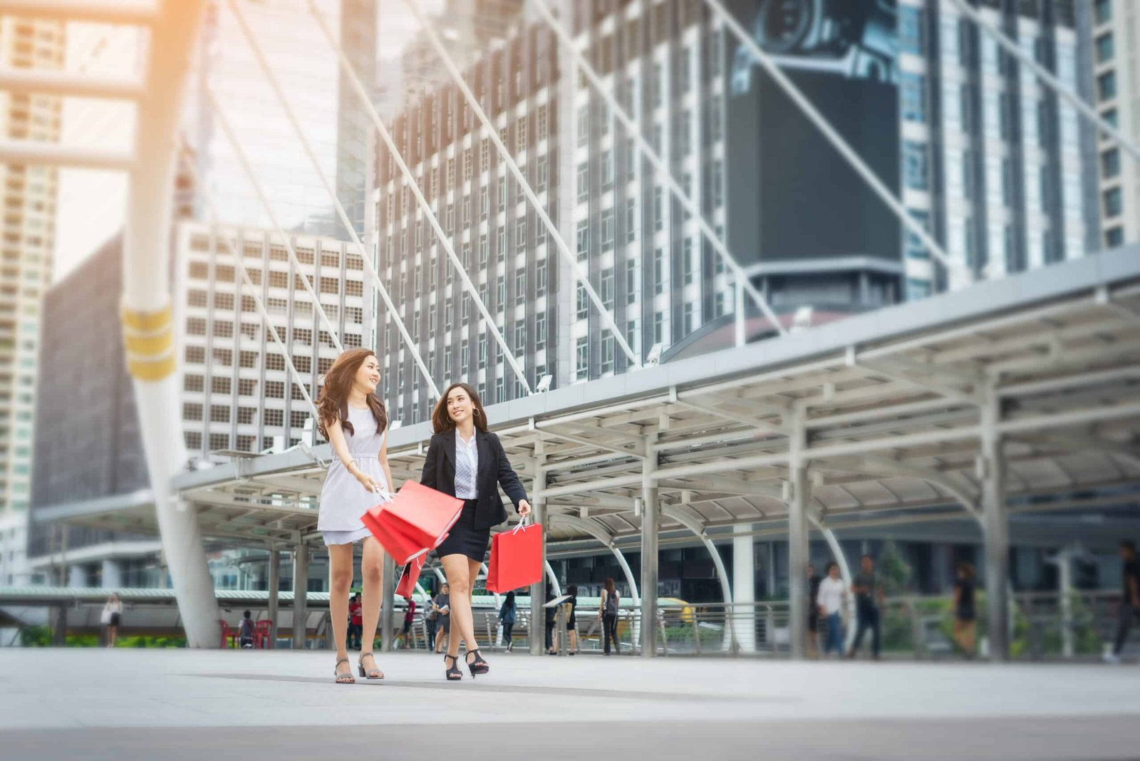 Designer and Luxury Brand Cafés in Bangkok: The Complete Guide 6 happy young business woman holding shopping bags scaled